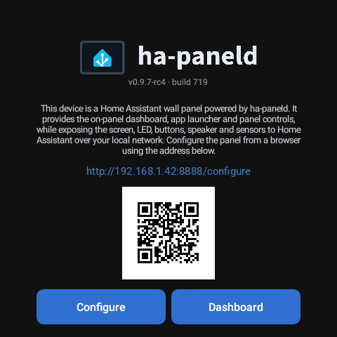 The panel’s standing screen before setup, showing its configuration address, a QR code, and Configure and Dashboard buttons